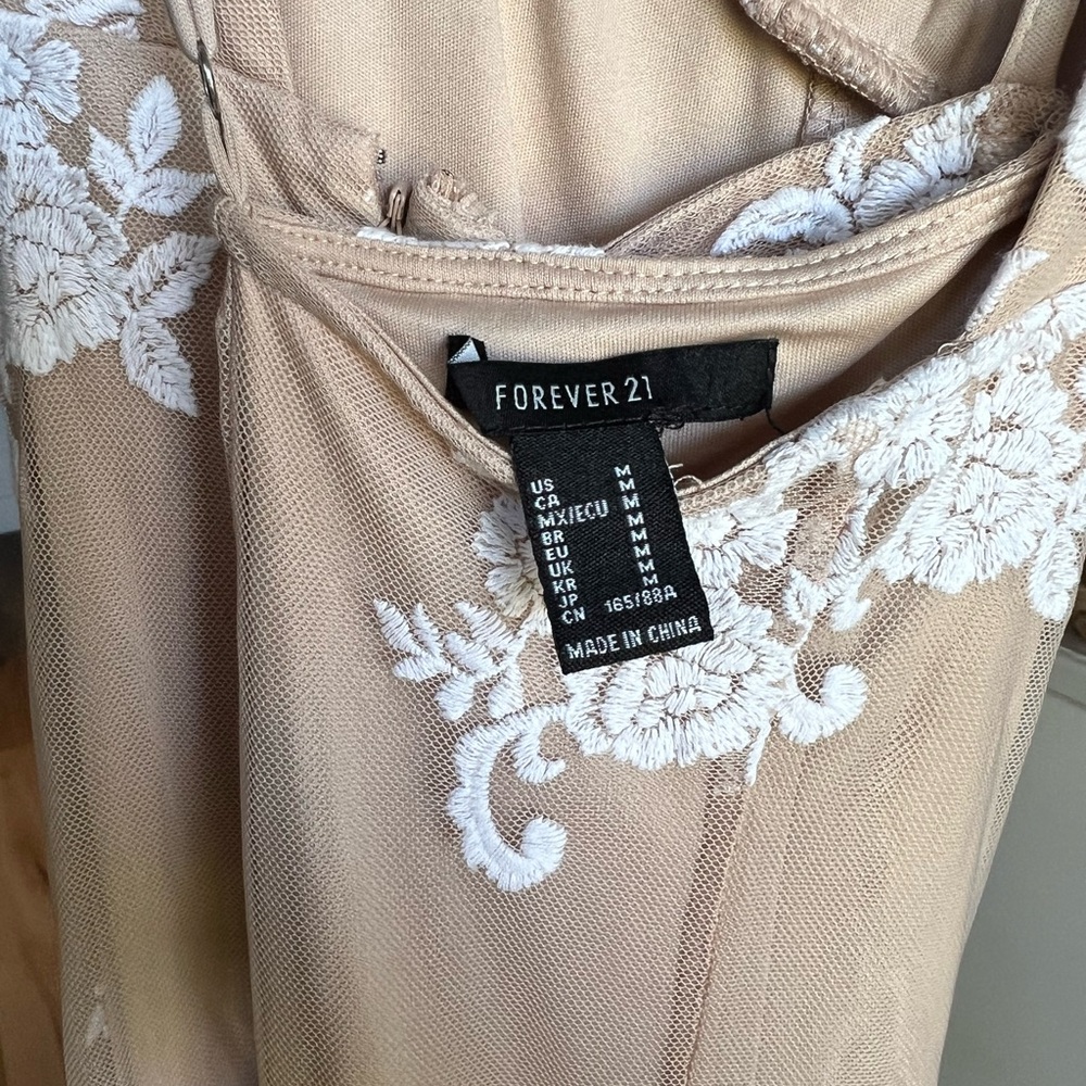 Nude slim fit dress w/floral appliqués. Worn once. Does not fit me anymore.